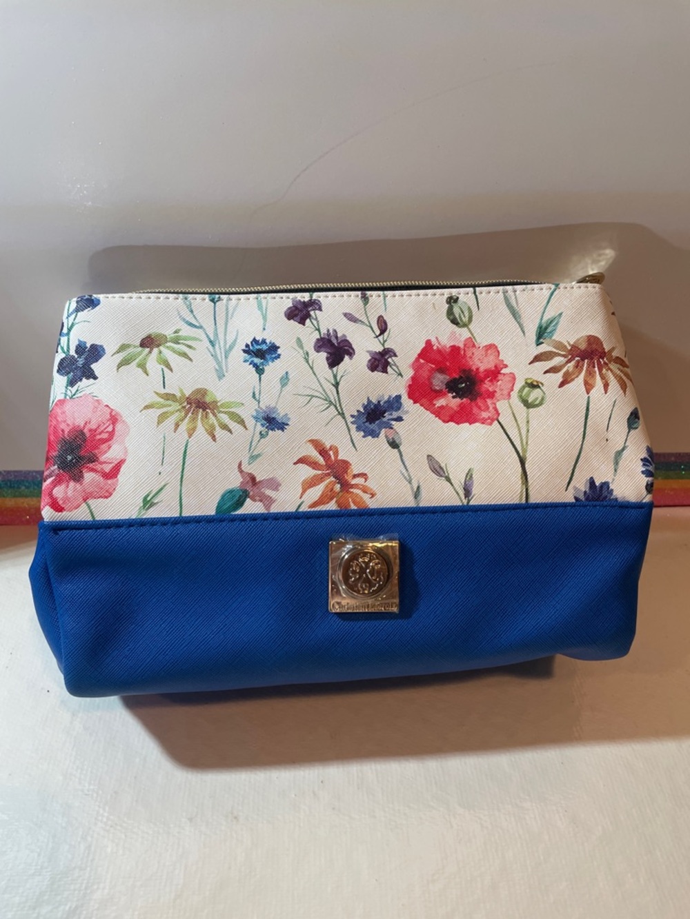 Blue Floral Cosmetic Pouch with Gold Emblem